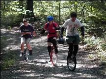 3 unicyclists